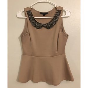 Peplum Blouse/embellished neck line